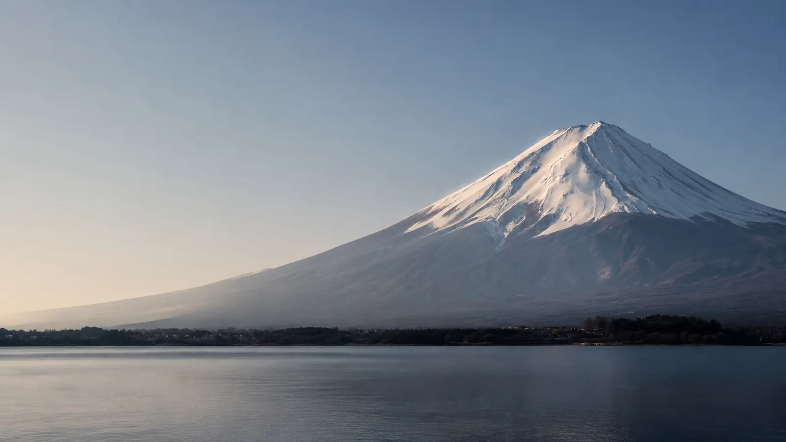 Mount Fuji at first light across a still lake